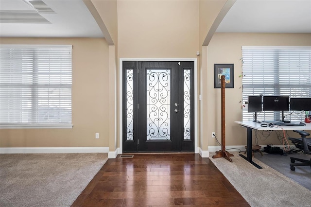 foyer with dark carpet