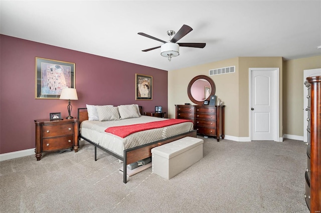 bedroom featuring ceiling fan and light carpet