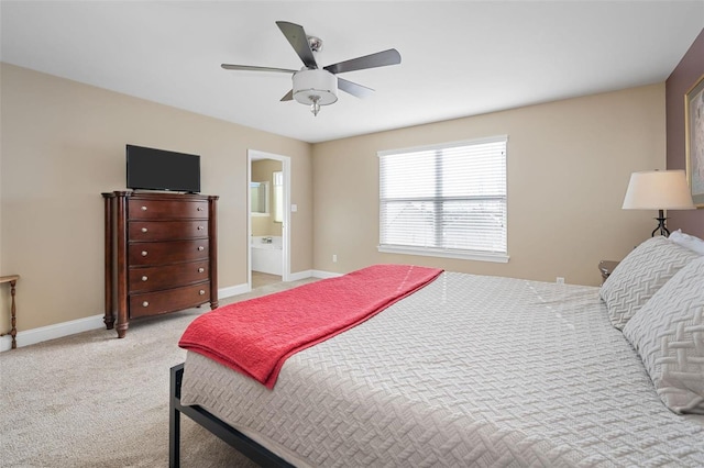 carpeted bedroom with connected bathroom and ceiling fan