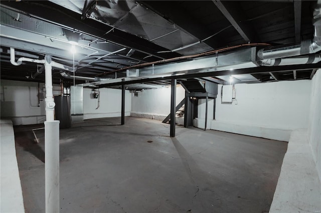 basement with electric panel and water heater