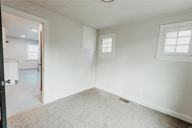 spare room with light colored carpet