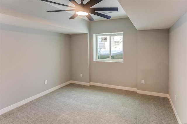 carpeted empty room featuring ceiling fan