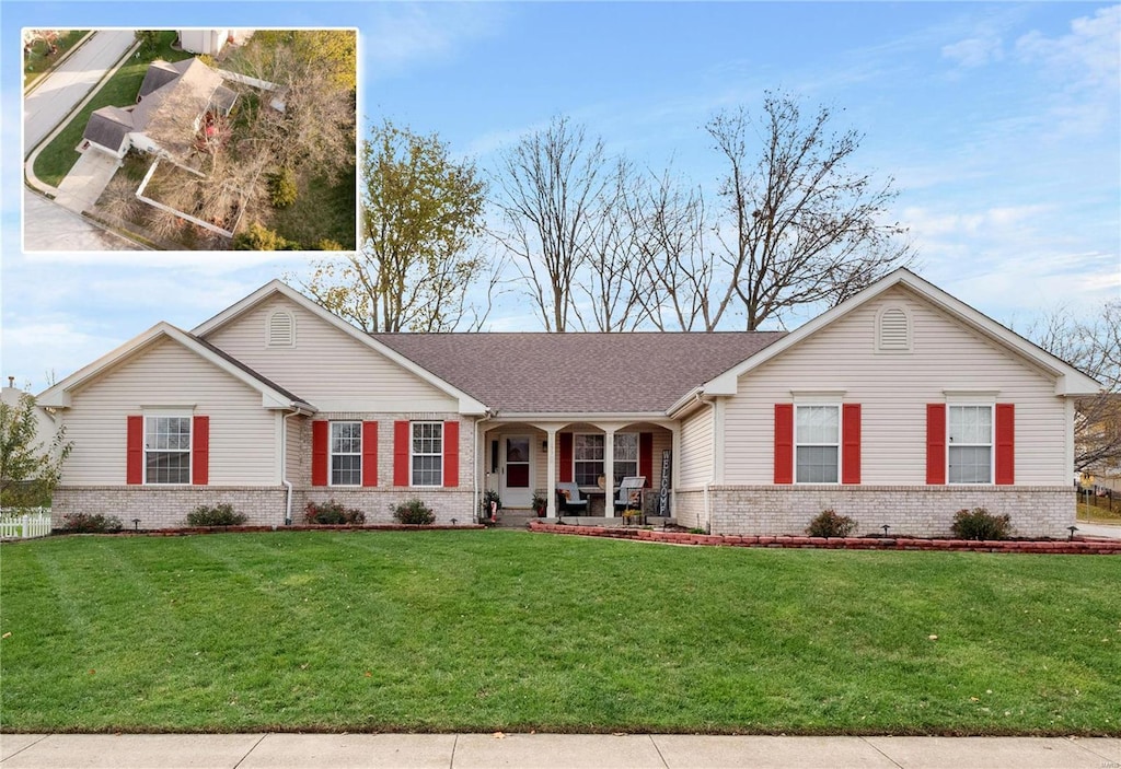 single story home with a front yard and a porch