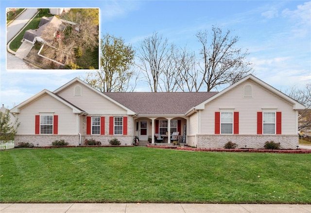 single story home with a front yard and a porch