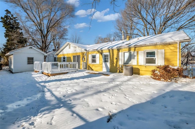 view of front of home featuring an outdoor structure and central air condition unit