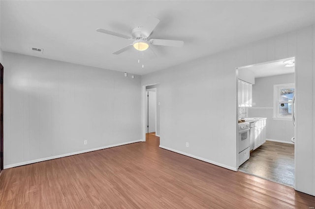 unfurnished room with ceiling fan and wood-type flooring