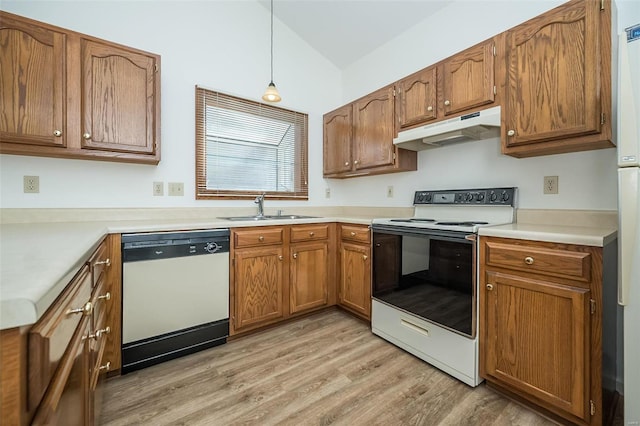 kitchen with white appliances, decorative light fixtures, light hardwood / wood-style floors, and sink