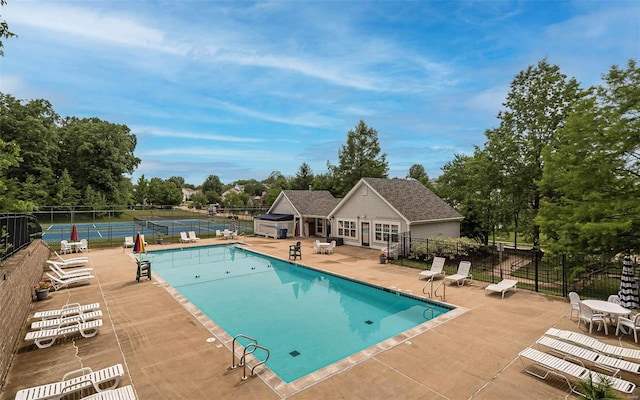 view of swimming pool with a patio area