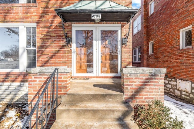 view of exterior entry featuring french doors