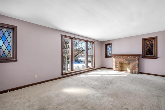 unfurnished living room featuring carpet and a fireplace