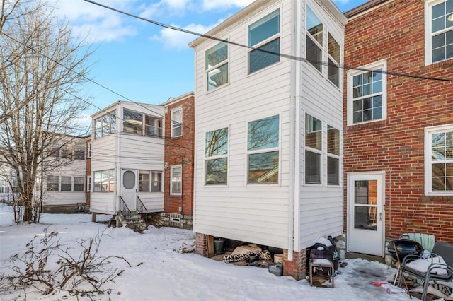 view of snow covered house