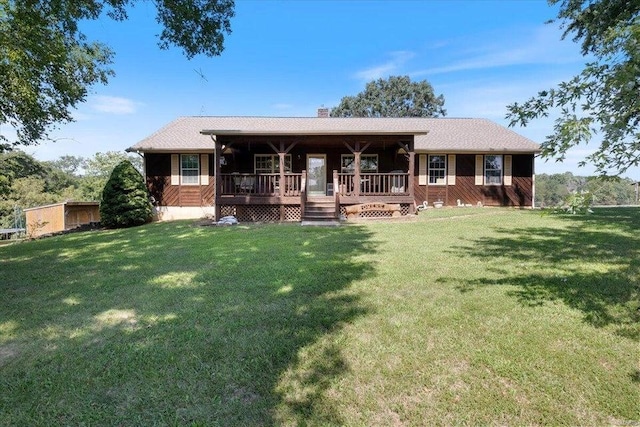 view of front of property featuring a chimney and a front lawn