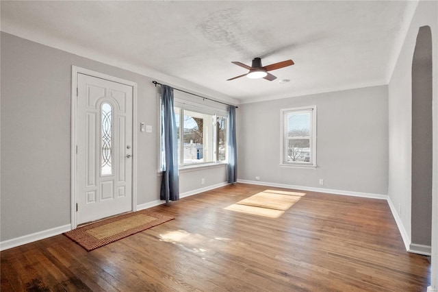 foyer entrance with ceiling fan and hardwood / wood-style floors