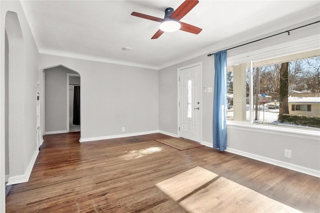 interior space featuring ceiling fan and dark wood-type flooring