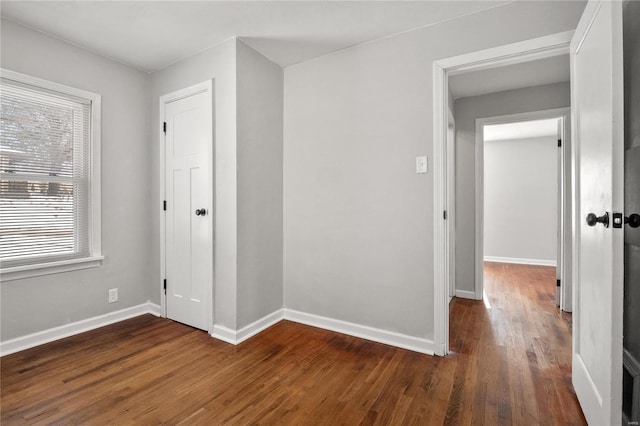 interior space featuring dark wood-type flooring and plenty of natural light