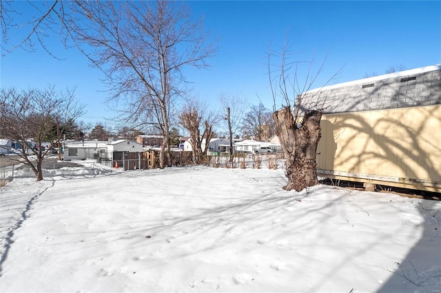 view of yard layered in snow