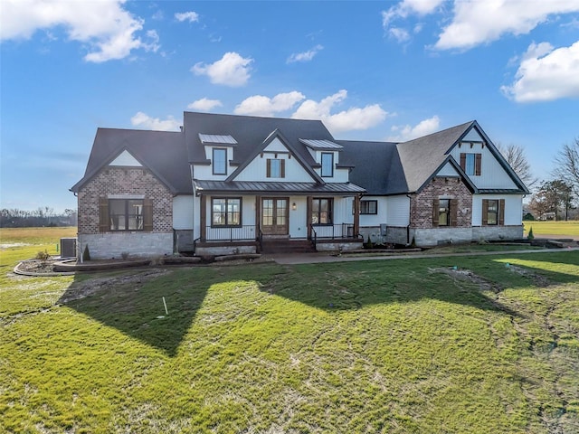 view of front of property featuring cooling unit, a front lawn, and a porch