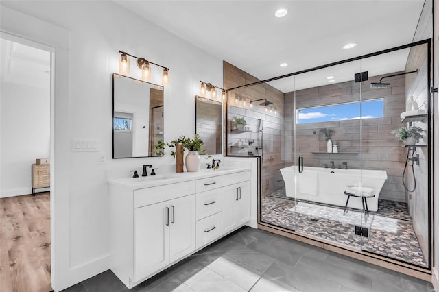 bathroom featuring tile patterned flooring, vanity, and independent shower and bath