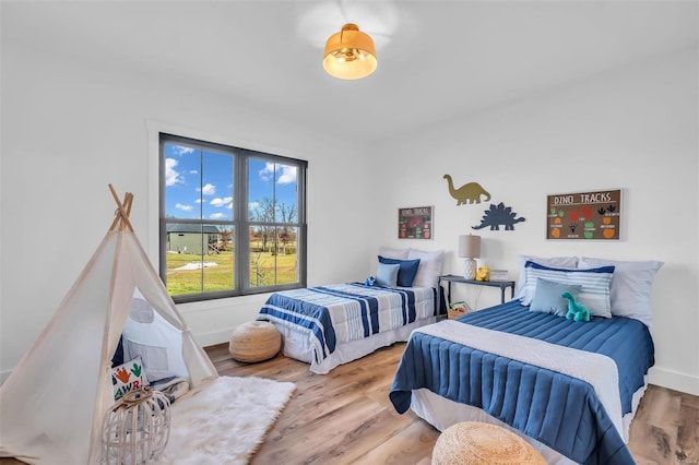 bedroom with hardwood / wood-style floors