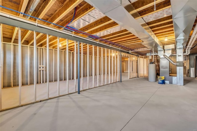 basement with heating unit and water heater