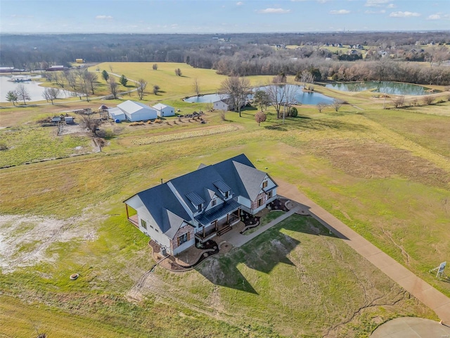 drone / aerial view featuring a rural view and a water view