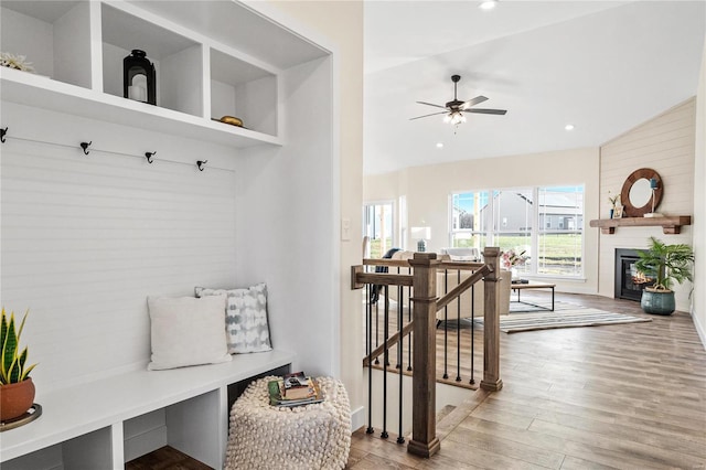 mudroom featuring ceiling fan, vaulted ceiling, and light wood-type flooring