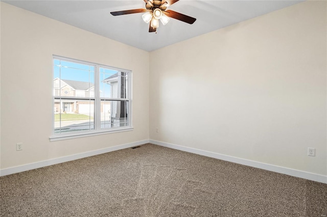 carpeted empty room with ceiling fan