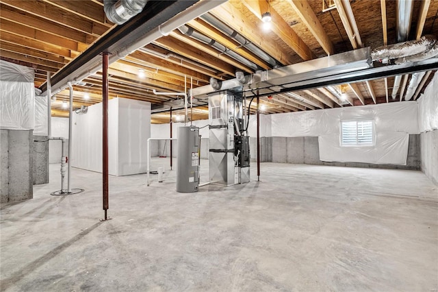 basement featuring heating unit and water heater