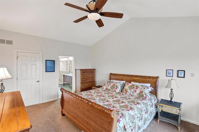 carpeted bedroom featuring ceiling fan, lofted ceiling, and connected bathroom