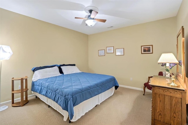 bedroom with light colored carpet and ceiling fan