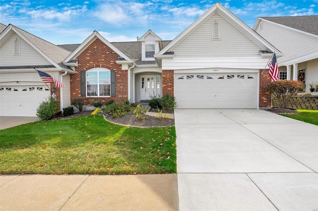 view of front facade featuring a garage and a front lawn