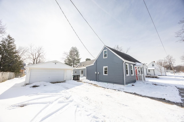 view of front of property with an outdoor structure and a garage