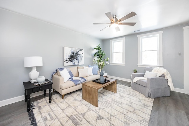 living room featuring ceiling fan and light wood-type flooring