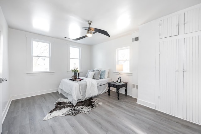 bedroom featuring ceiling fan and light hardwood / wood-style floors