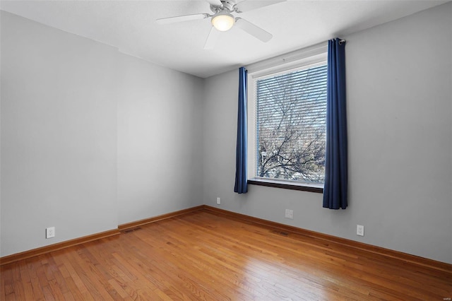 unfurnished room with ceiling fan and light hardwood / wood-style floors