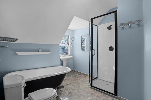 bathroom with toilet, shower with separate bathtub, and vaulted ceiling