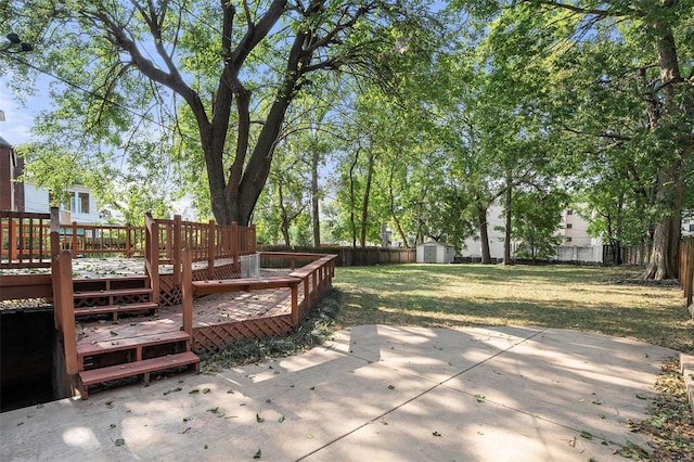 exterior space with a patio, a yard, and a storage unit