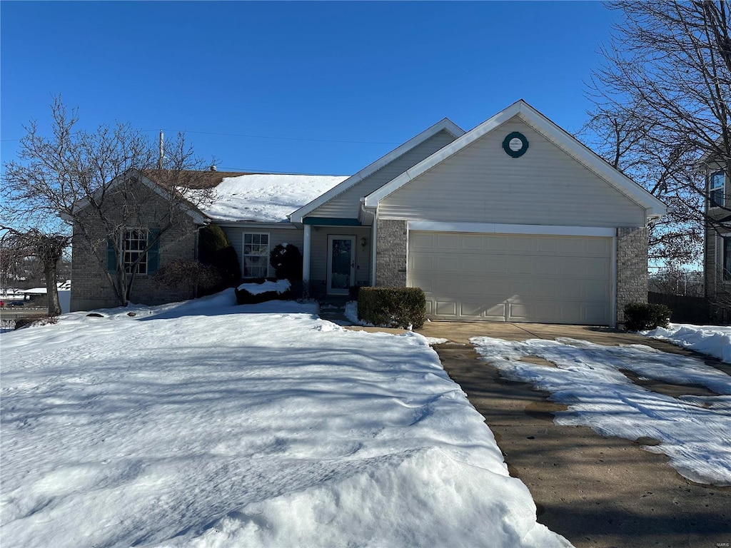 single story home featuring a garage