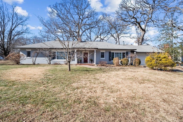 rear view of property featuring a yard