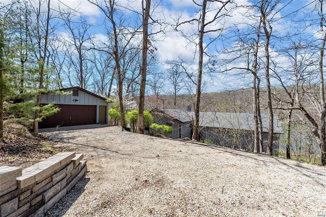 view of home's exterior featuring a garage and an outdoor structure