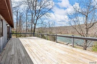 wooden terrace with a water view