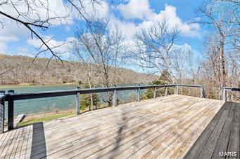 wooden deck featuring a water view