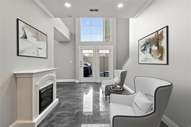 living room featuring crown molding and french doors