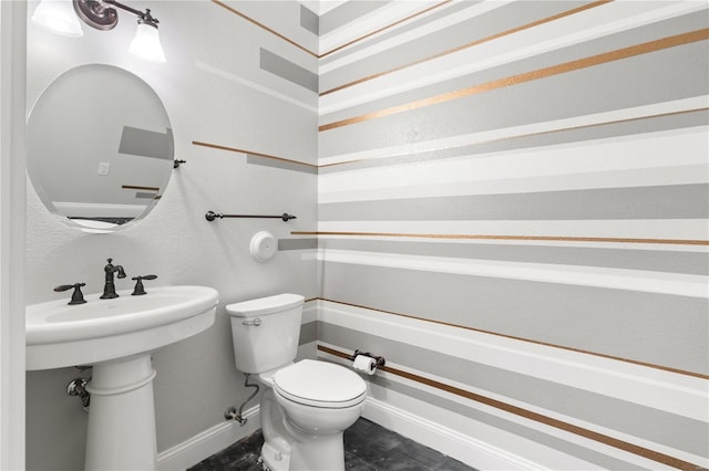 bathroom featuring sink and toilet