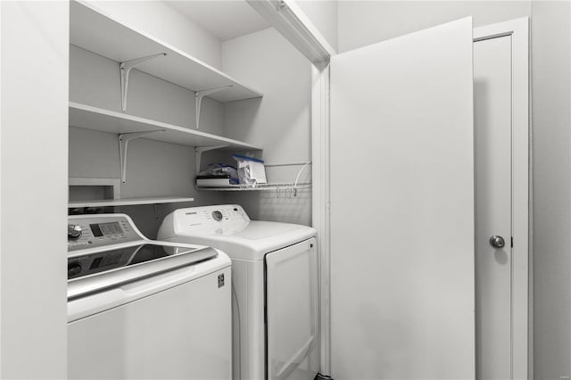 laundry room featuring washing machine and dryer