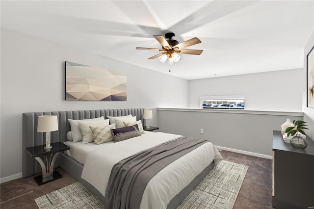 bedroom with dark carpet and ceiling fan