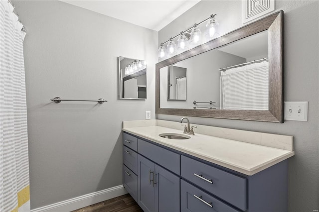 bathroom featuring hardwood / wood-style floors and vanity