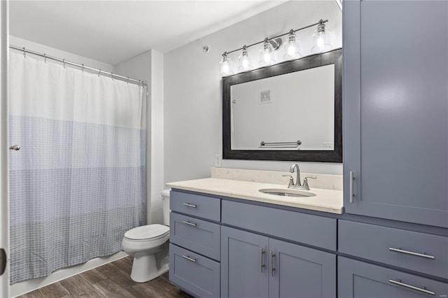 full bathroom featuring shower / bathtub combination with curtain, vanity, toilet, and wood-type flooring