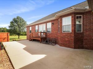 exterior space featuring a deck and a patio area