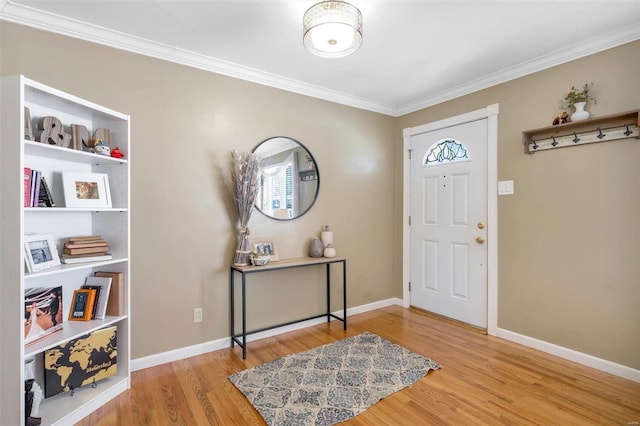 entrance foyer featuring hardwood / wood-style floors and crown molding